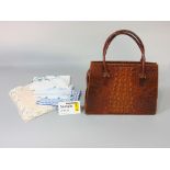 Vintage crocodile skin handbag with suede interior, zip fastening and looped handles and a remnant