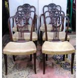 A set of six (4&2) 19th century mahogany dining chairs the carved splats with harebell and anthemion