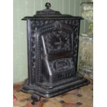 A Triumph Columbian Stoveworks decorative cast iron stove, with repeating foliate and simulated