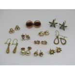 Collection of 9ct earrings to include a paste set pair of star form, pair of tapered drops, pair