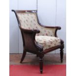 A Regency style mahogany library chair with scrolled back and arms on fluted supports