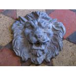 A lead lions mask wall plaque/fountain head with well defined features, 28cm square approx
