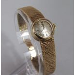Vintage ladies 9ct Omega Lady Matic cocktail/dress watch, the champagne dial with gilt baton markers