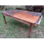 A 19th century pine farmhouse kitchen table of rectangular form, with planked top over and end