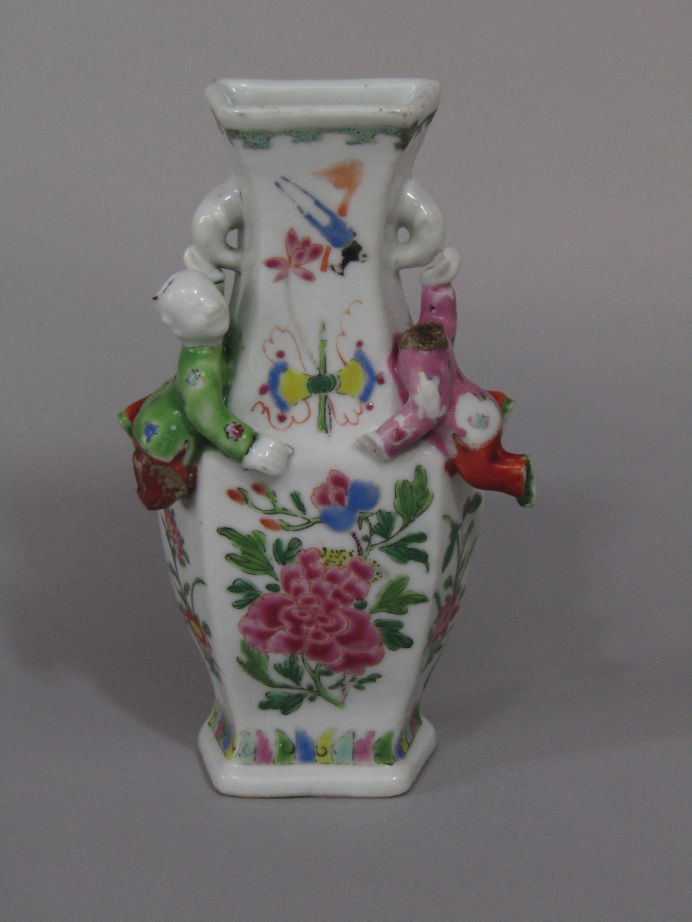 An unusual 19th century oriental wall pocket in the form of a vase with applied figures of