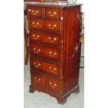 A reproduction Georgian style mahogany veneered chest of two short over five long graduated