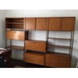 A Ladderax sectional modular adjustable shelving unit comprising a three drawer chest, three