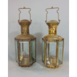 A pair of brass and glass hexagonal hall lanterns, with bevelled star cut glass panels, 32 cm