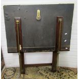 A folio stand in the form of a ledger with folding mahogany frame and brass fittings