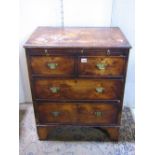 A small reproduction Georgian style walnut veneered bachelors chest with brushing slide over two