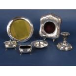 A mixed collection of silver to include a circular silver applied tondo easel frame, a planished