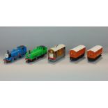 Five items from Hornby 00 gauge Thomas the Tank Engine series including Thomas, The Duck, Toby the