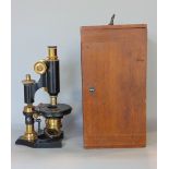 Good ebonised and brass Nachet a Paris cased microscope, the lens marked C Baker of London