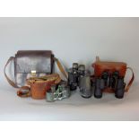 Cased set of Super Zenith field binoculars, together with a further cased set of Zeiss Prism