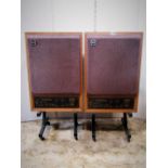 A pair of Tannoy Little Red Monitor speakers and stands, serial number 3149-005527 and 41 (used