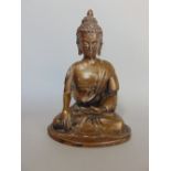 A cast bronze study of a seated Buddhavista in the lotus position, 16 cm high