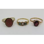 Three rings comprising an antique pearl and turquoise example, unmarked, size L, a further