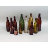 A collection of antique advertising/beer bottles, many of local interest (11)