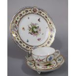 A 19th century continental trio, possibly Swiss, with fine quality painted decoration of a laurel
