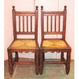 A set of six Edwardian Arts & Crafts style oak dining chairs with reeded frames, drop in rush