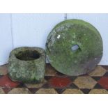 A weathered carved natural stone mortar, approx 26cm square x 17cm high with circular cut out,
