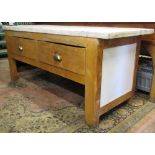 A 19th century work table in pine enclosing two deep frieze drawers over an open base supporting a