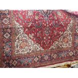 Axminster 'Sharabian' carpet with intricate floral decoration and central blue medallion upon a
