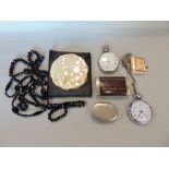 A box containing a collection of interesting items to include a silver pocket watch, a further