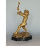Gilt spelter character group of a cherub, on a naturalist base and further green veined marble