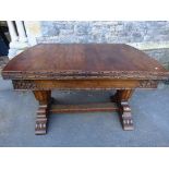 A 1930s oak drawleaf dining table, the rectangular top with canted corners and moulded outline,