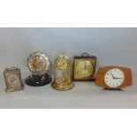 A collection of various vintage retro mantle clocks to include a Majak lucite case mantle clock, a