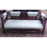 A Victorian parlour room sofa, the carved panel mahogany showwood frame with repeating geometric,