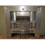 A good quality neo-classical design electric fire insert, with pierced serpentine grill and basket