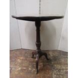 Georgian oak snap top table, the circular top raised on a turned pillar and tripod base