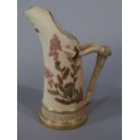 A Royal Worcester blush ivory tusk shaped jug with painted and gilded floral decoration, puce