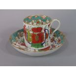 An early 19th century Derby coffee can and saucer of fluted form with polychrome painted chinoiserie