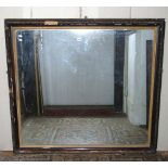 A 19th century wall mirror of rectangular form, with gilded slip, the deep moulded frame with