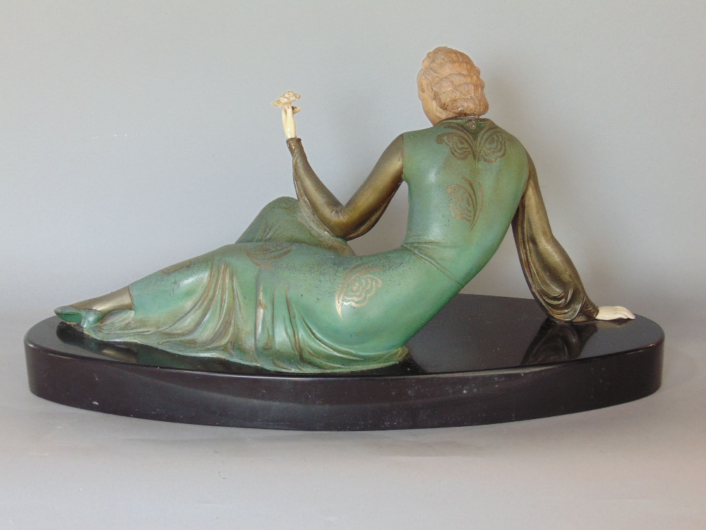 Art deco figural study of a recumbent lady holding a flower, with possible ivory head and hands, - Image 2 of 3