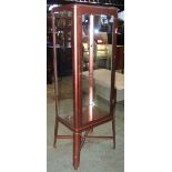 A floorstanding shop display cabinet, with coppered frame enclosing glazed panels, single door,