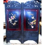 A Japanese freestanding two fold screen, the ebonised frame with carved foliate and bird detail