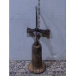 An old cast iron trumpet shaped bell? with wall mounting bracket, both having raised serial numbers