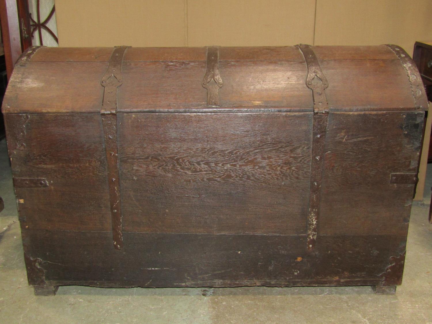 An 18th century oak domed top trunk/coffer with exposed strap work hinges, lasps and fittings and - Image 4 of 4