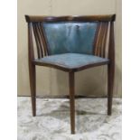 An inlaid Edwardian mahogany corner chair with box wood stringing and upholstered pad seat and
