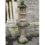 A weathered composition stone five sectional pagoda, with tapered hexagonal base, 157cm high