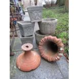 A weathered terracotta foliate bell shaped garden urn (AF), together with a pair of weathered