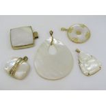 Five mother of pearl pendants mounted in gold comprising two x 14ct and three x 9ct, to include a