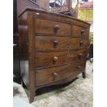 A Georgian mahogany bowfronted chest of three long and two short drawers, with crossbanded