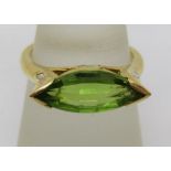 Marquise peridot and diamond ring, unmarked, tests as 18ct gold, size O, 5.5g