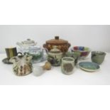 A mixed collection of various studio pottery to include a faience glazed teapot, a further white
