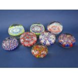 A collection of Millefiori paperweights with various coloured canes (8)